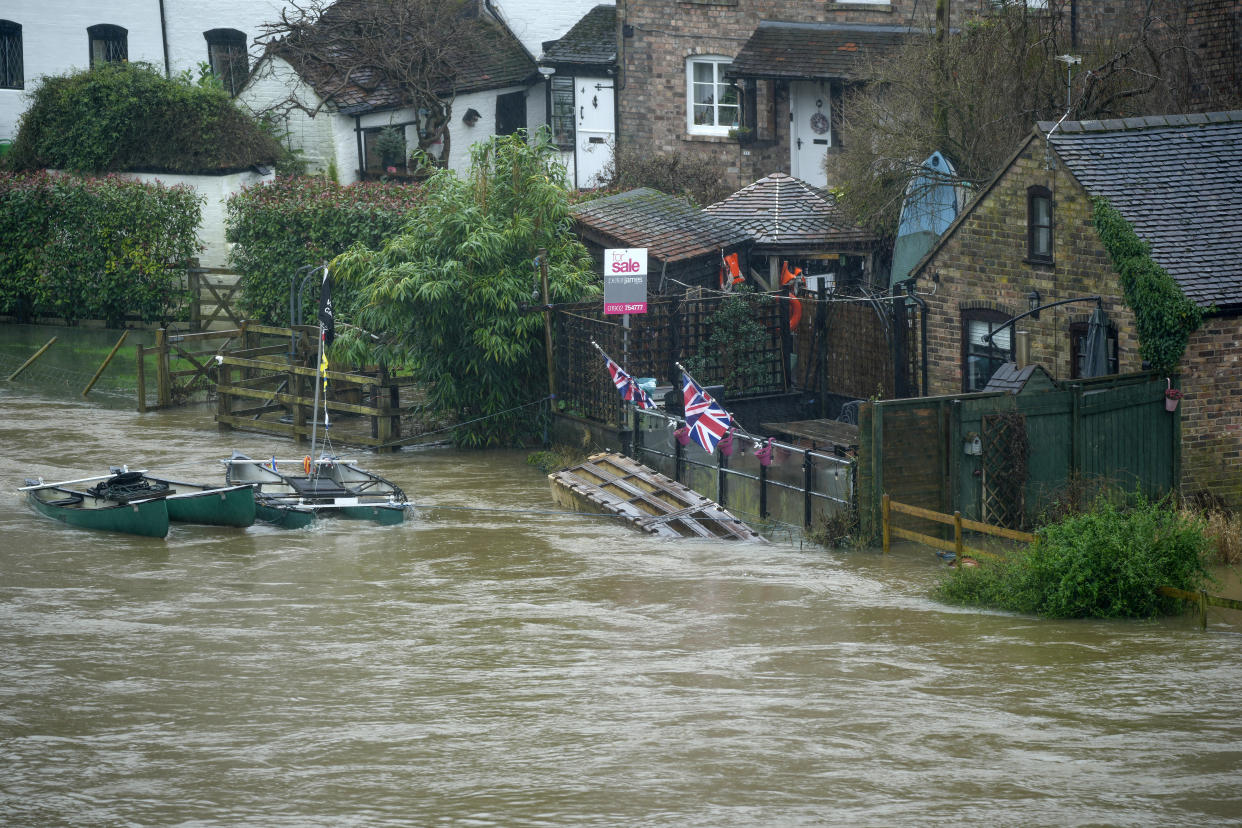 IRONBRIDGE, ENGLAND - JANUARY 02: Flood water from tjhe River Severn begins to encroach on riverside properties on January 02, 2024 in Ironbridge, England. The Met Office issued warnings for wind and rain in parts of England as Storm Henk arrived. Towns along the River Severn had already experienced flooding following another recent storm. (Photo by Christopher Furlong/Getty Images)