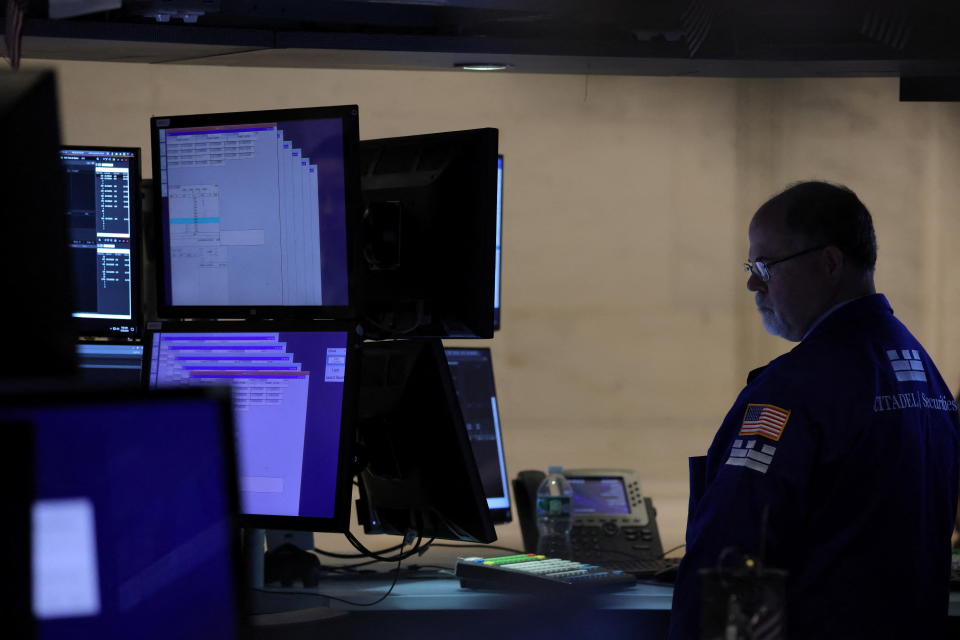 A trader works on the trading floor at the New York Stock Exchange (NYSE) in Manhattan, New York City, U.S., May 20, 2022. REUTERS/Andrew Kelly