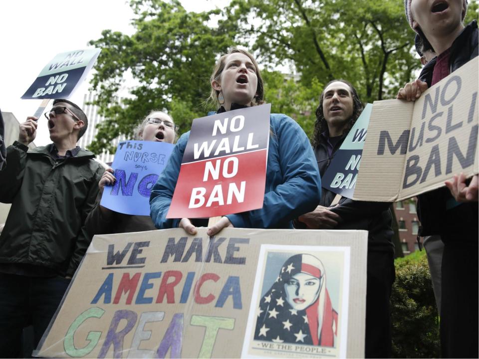 People protest outside as the 9th US Circuit Court of Appeals prepares to hear arguments on US President Donald Trump's revised travel ban in Seattle, Washington on 15 May 2017: JASON REDMOND/AFP/Getty Images