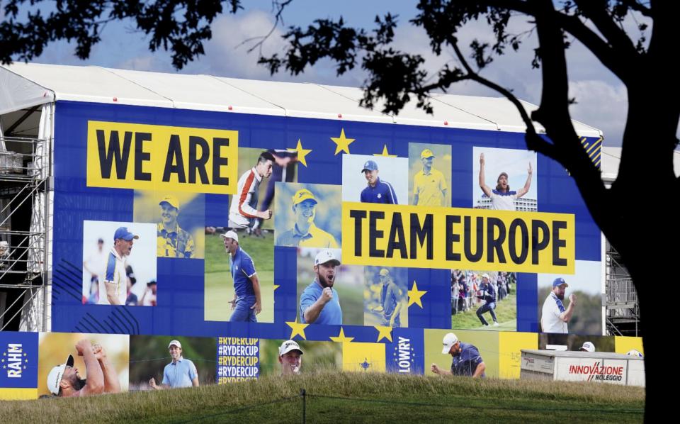 Team Europe portraits decorate the stands at practice - Mullets, drunken singing and F-bombs: The Ryder Cup is golf on steroids