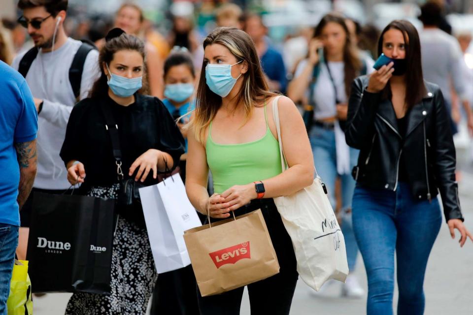 Shoppers wearing masks in London (AFP via Getty Images)