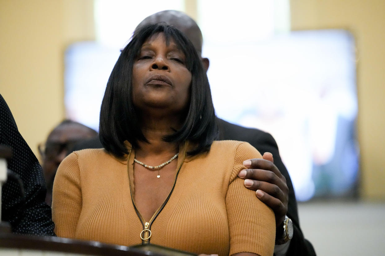 RowVaughn Wells, mother of Tyre Nichols, who died after being beaten by Memphis police officers, is comforted at a news conference with civil rights Attorney Ben Crump in Memphis, Tenn., Friday, Jan. 27, 2023. (AP Photo/Gerald Herbert)