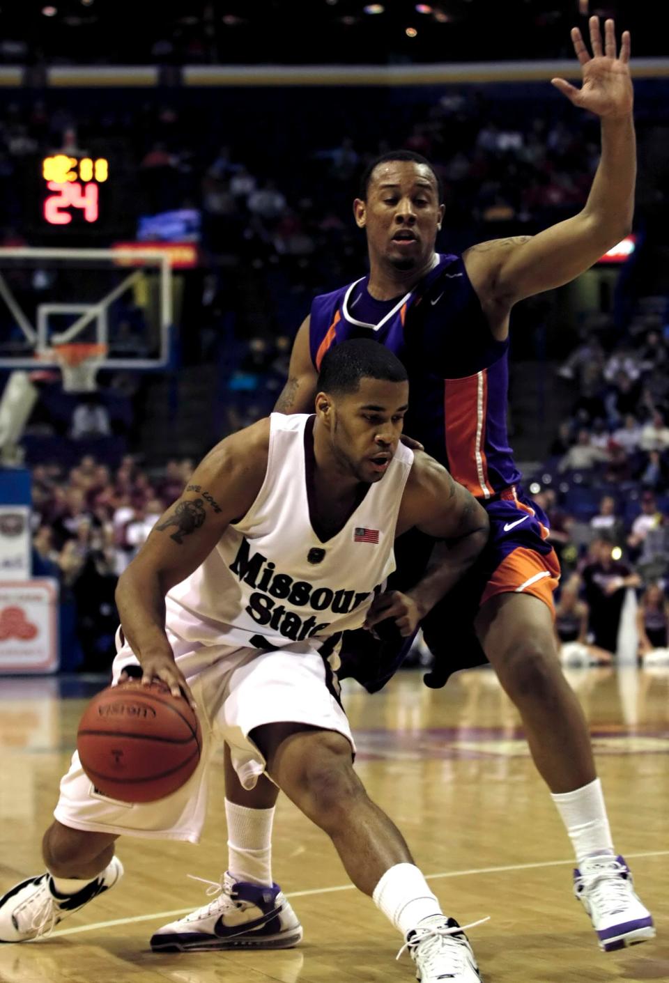 Missouri State's Dale Lamberth tries to drive around Evansville's Nate Garner in a Missouri Valley conference tournament first round basketball game, Thursday, March 6, 2008, in St. Louis.