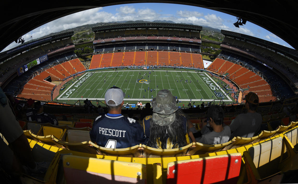 Fans wait for the start of a preseason NFL football game between the Los Angeles Rams and the Dallas Cowboys on Saturday, Aug. 17, 2019, in Honolulu. (AP Photo/Mark J. Terrill)