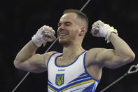 Oleg Verniaiev of the Ukraine celebrates after his performance on the horizontal bar in the men's all-around final at the Gymnastics World Championships in Stuttgart, Germany, Friday, Oct. 11, 2019. (AP Photo/Matthias Schrader)