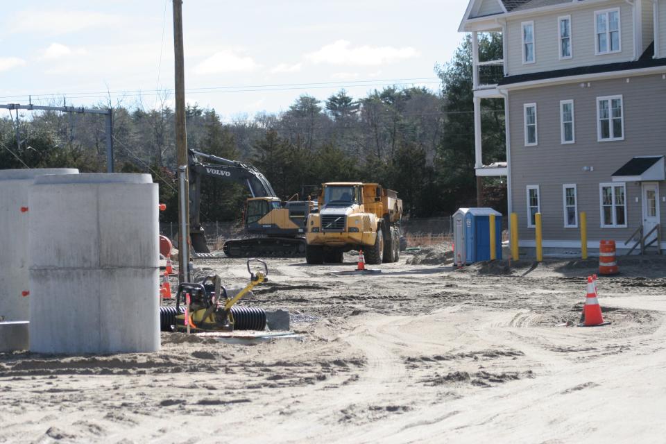 Construction equipment sits idle at the site of the Imperial on Greenwich condominiums in East Greenwich, which is under a stop-work order by the town.