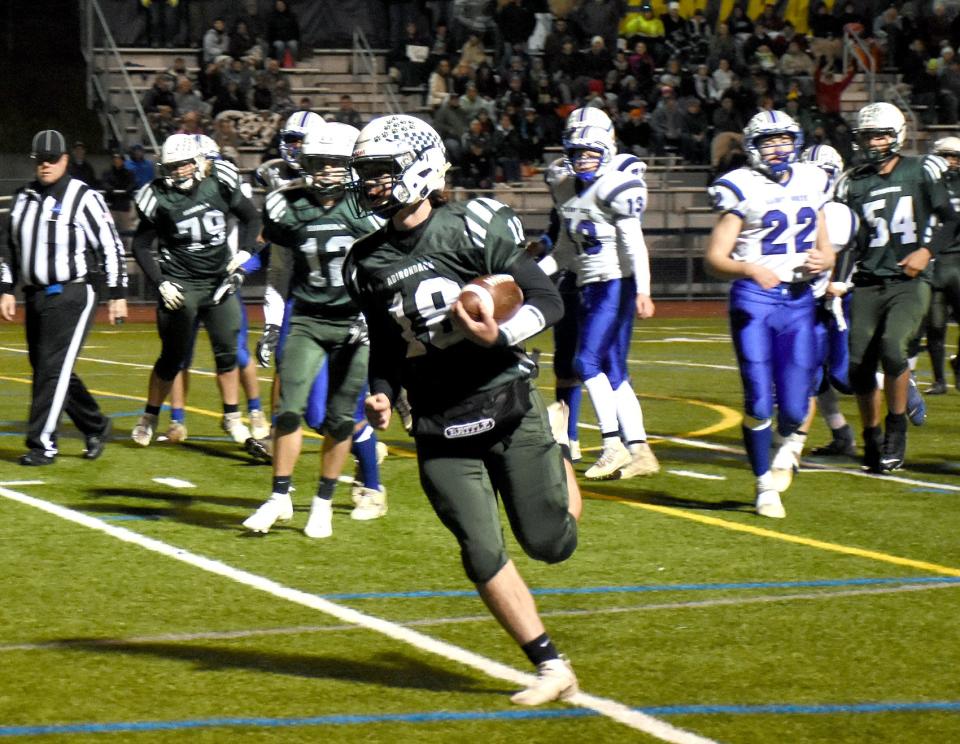 Adirondack quarterback Brett Sanford (18) runs for a touchdown Section III's 2021 Class D semifinalsin Ilion. Now a senior competing in Class C2, Sanford threw a fourth-quarter touchdown pass to John Hennessey to give the Wildcats the lead in Friday's 30-27 victory over General Brown.