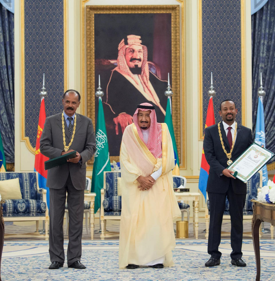 In this photograph released by the state-run Saudi Press Agency, Saudi King Salman, center, receives Eritrean President Isaias Afwerki, left, and Ethiopian Prime Minister Abiy Ahmed, right, in Jiddah, Saudi Arabia on Sunday, Sept. 16, 2018. The leaders of Ethiopia and Eritrea were in Saudi Arabia on Sunday to sign a peace accord between the two East African nations. (Saudi Press Agency via AP)