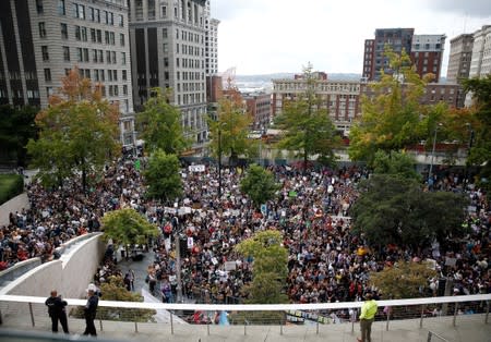 People gather at Seattle City Hall during a Climate Strike march in Seattle