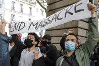 Demonstrators display a banner during a banned protest in support of Palestinians in the Gaza Strip, Saturday, May, 15, 2021 in Paris. Marches in support of Palestinians in the Gaza Strip were being held Saturday in a dozen French cities, but the focus was on Paris, where riot police got ready as organizers said they would defy a ban on the protest. (AP Photo/Michel Euler)