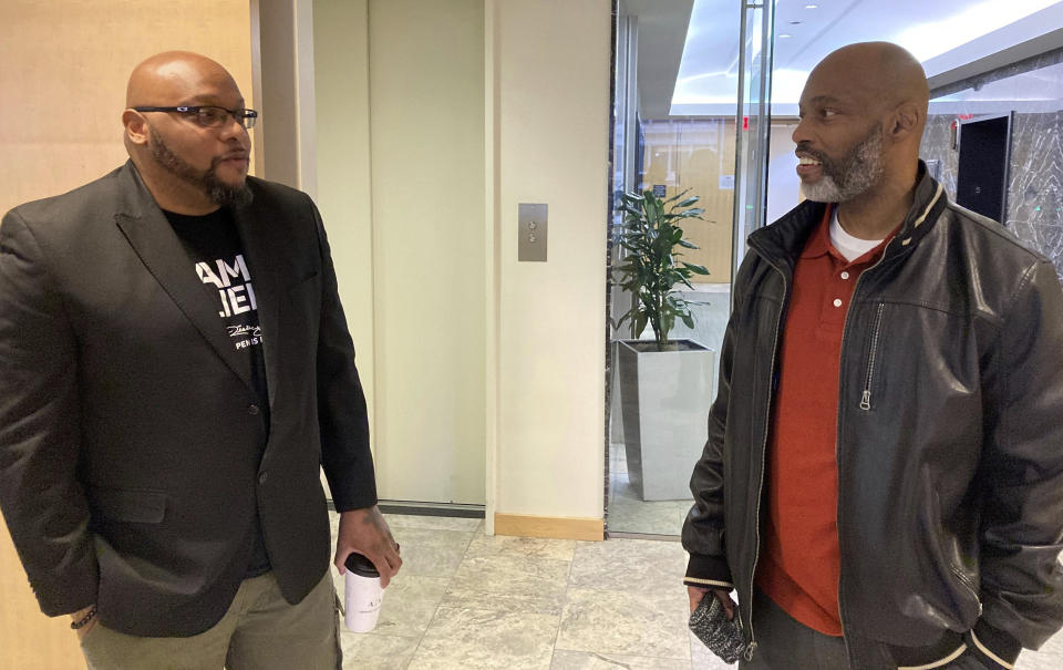 Lamar Johnson, right, talks with his friend and former cellmate Ricky Kidd on Friday, Feb. 17, 2023, at a law office in Clayton, Mo., near St. Louis. Both men have been freed from prison after judges determined they were wrongfully convicted in murder cases. (AP Photo/Jim Salter)