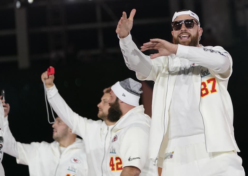 Kansas City Chiefs Travis Kelce (87) arrives with his teammates for Opening Night for the NFL Super Bowl 54 football game Monday, Jan. 27, 2020, at Marlins Park in Miami. (AP Photo/David J. Phillip)