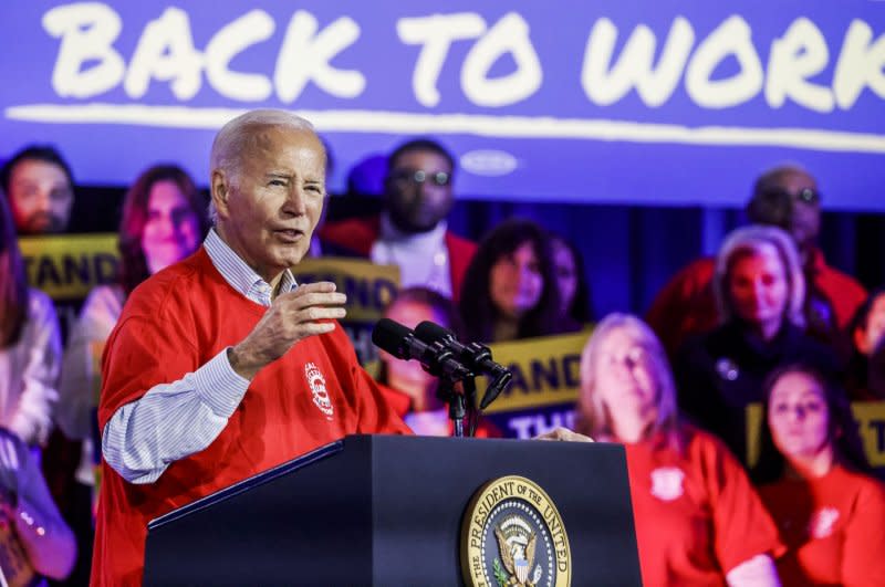 President Joe Biden praised the work of unions as he joined UAW President Shawn Fain and Illinois Gov. J.B. Pritzker Thursday to mark the re-opening of the Belvidere, Ill., auto plant and the recent UAW contract that won historic gains for auto workers. Photo by Tannen Maury/UPI