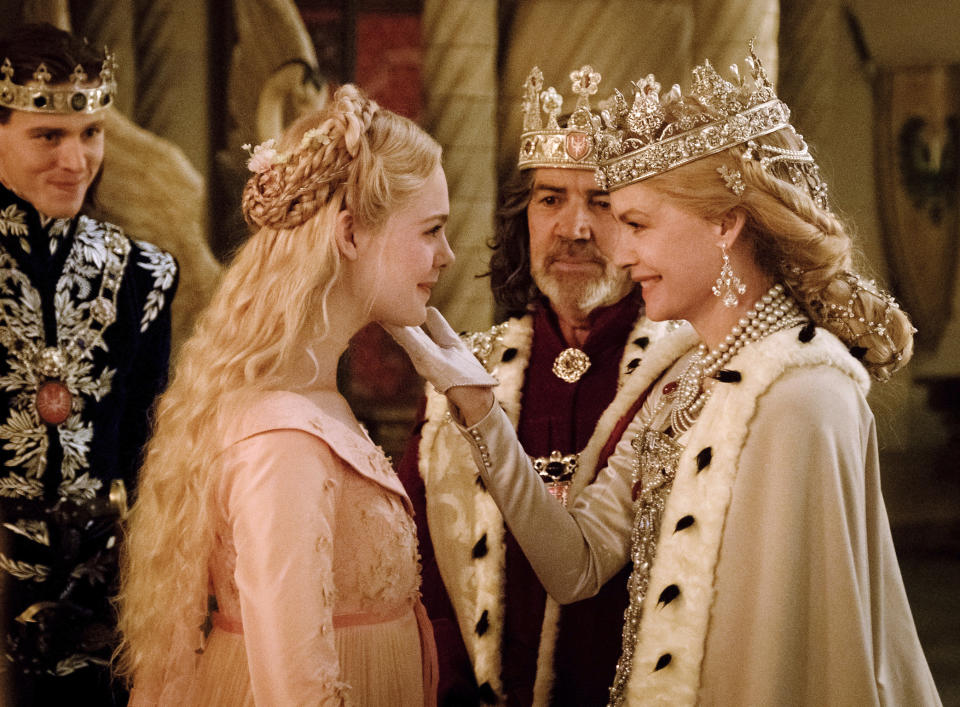 This image released by Disney shows, from left, Harris Dickinson as Prince Phillip, Elle Fanning as Aurora, Robert Lindsay as King John and Michelle Pfeiffer as Queen Ingrith in a scene from the film, "Maleficent: Mistress of Evil." (Jaap Buitendijk/Disney via AP)