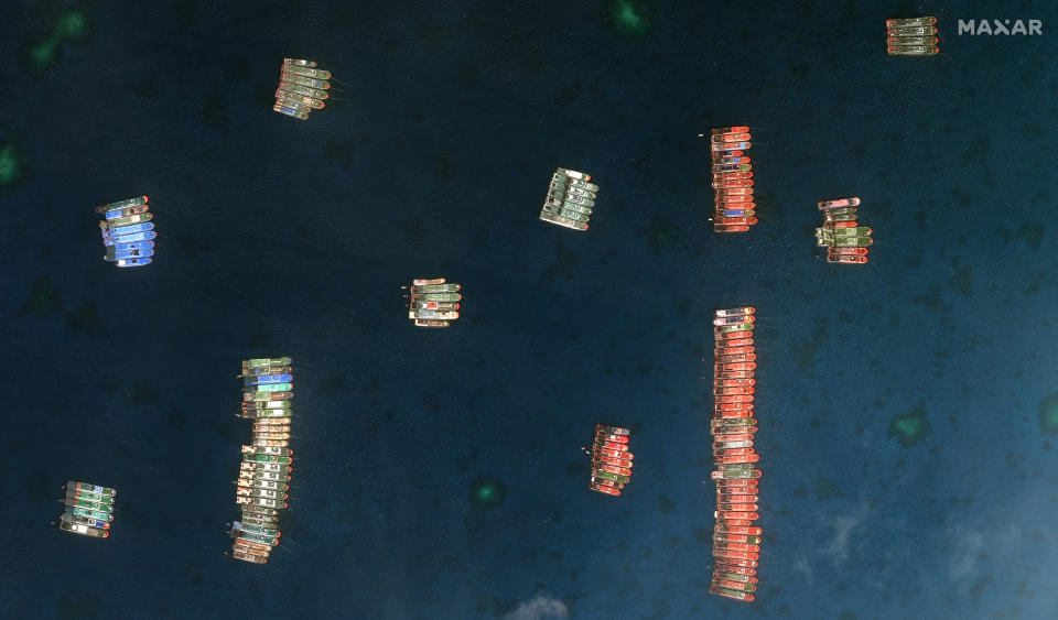 This satellite image provided by Maxar Technologies shows Chinese vessels in the Whitsun Reef located in the disputed South China Sea. Tuesday, March 23, 2021. The United States said Tuesday it’s backing the Philippines in a new standoff with Beijing in the disputed South China Sea, where Manila has asked a Chinese fishing flotilla to leave a reef. China ignored the call, insisting it owns the offshore territory. (©2021 Maxar Technologies via AP)