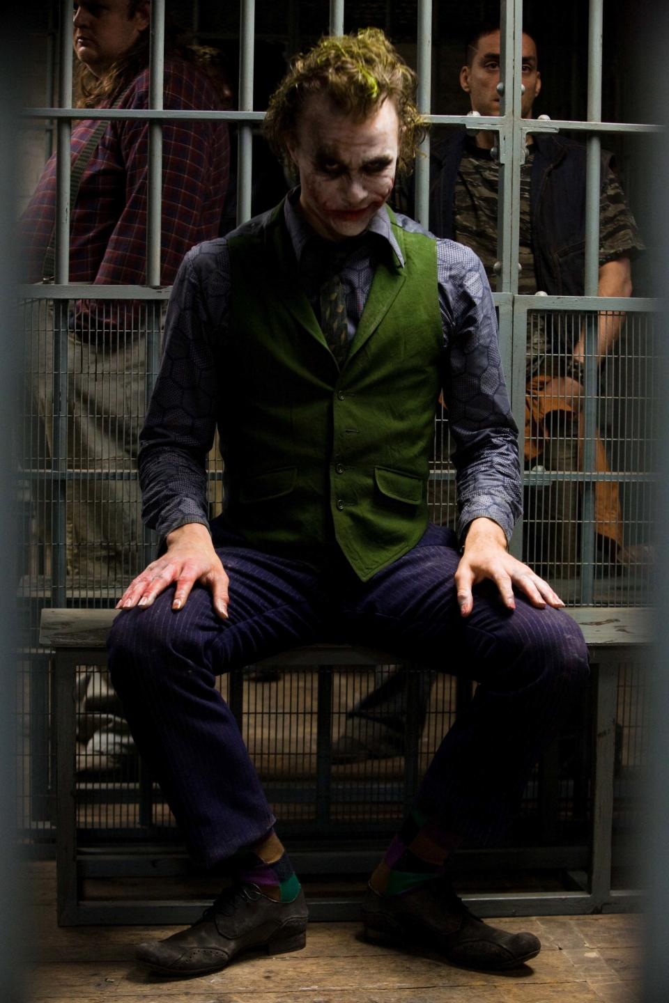 FILE - This undated file photo originally released by Warner Bros., shows actor Heath Ledger as The Joker in a scene from "The Dark Knight." The character has been captivating audiences since he was established as the murderous yin to the Batman's yang in 1940 by DC Comics writers Bob Kane and Bill Finger with artist Jerry Robinson. (AP Photo/Warner Bros., Stephen Vaughan)