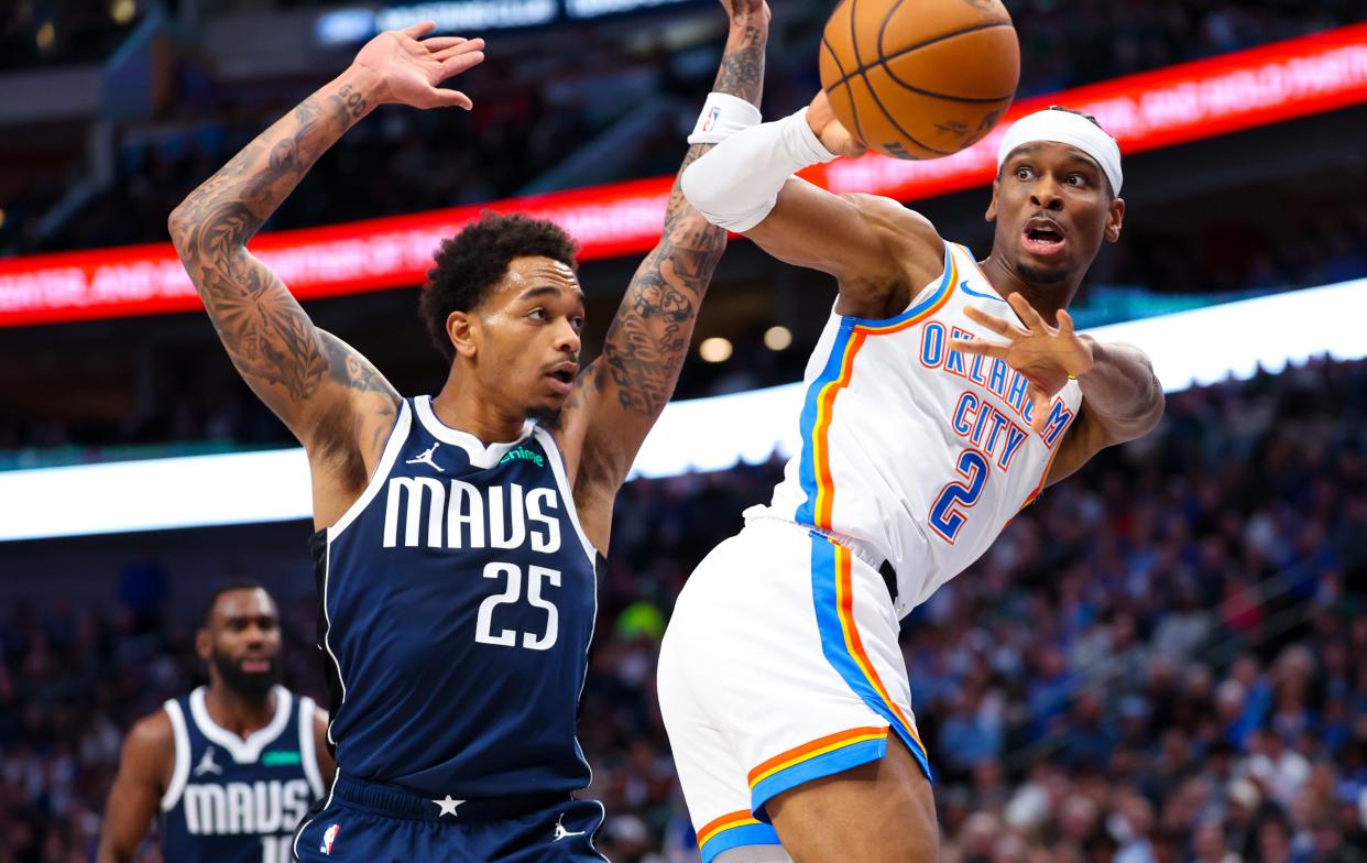 Feb 10, 2024; Dallas, Texas, USA; Oklahoma City Thunder guard Shai Gilgeous-Alexander (2) passes past Dallas Mavericks forward P.J. Washington (25) during the first half at American Airlines Center. Mandatory Credit: Kevin Jairaj-USA TODAY Sports