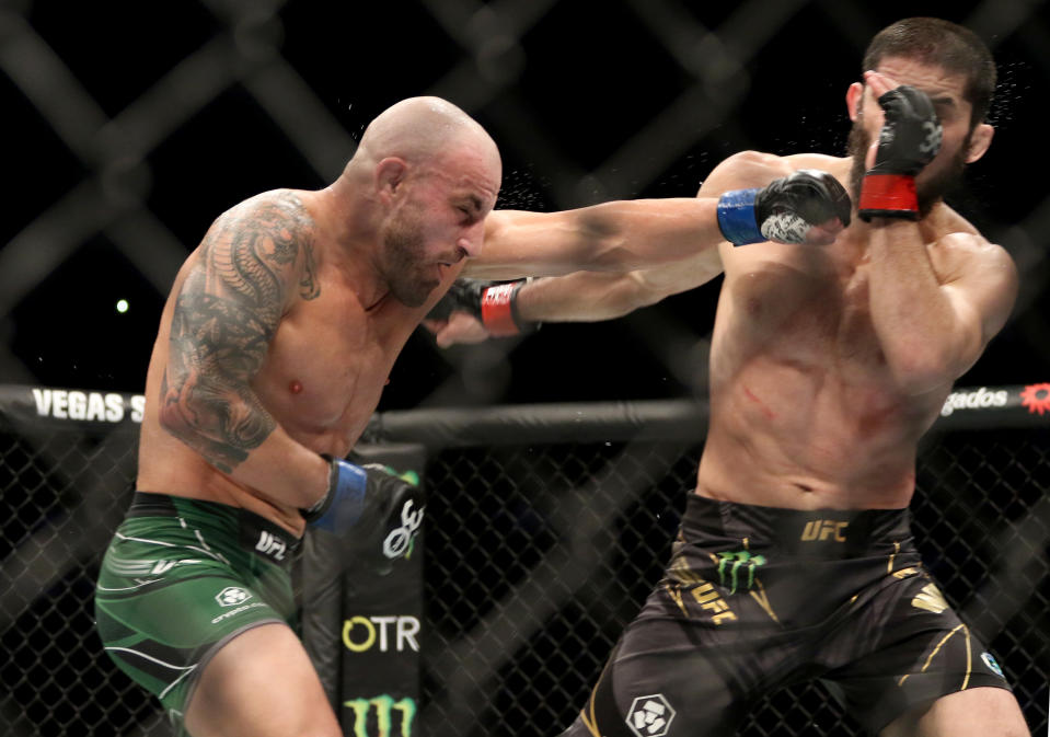 Feb 12, 2023; Perth, WA, AUSTRALIA; Islam Makhachev (red gloves) fights Alexander Volkanovski (blue gloves) during UFC 284 at RAC Arena. Mandatory Credit: Jasmin Frank-USA TODAY Sports