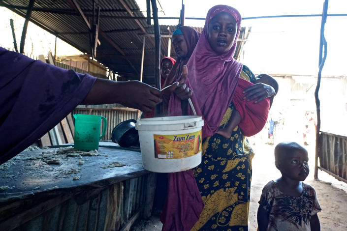 <p>At a World Food program ‘wet food’ distribution center in central Mogadishu. Hundreds of new arrivals, mostly from the hardest hit drought regions in the south, are pouring into Mogadishu in search of food. (Photo: Giles Clarke/Getty Images) </p>