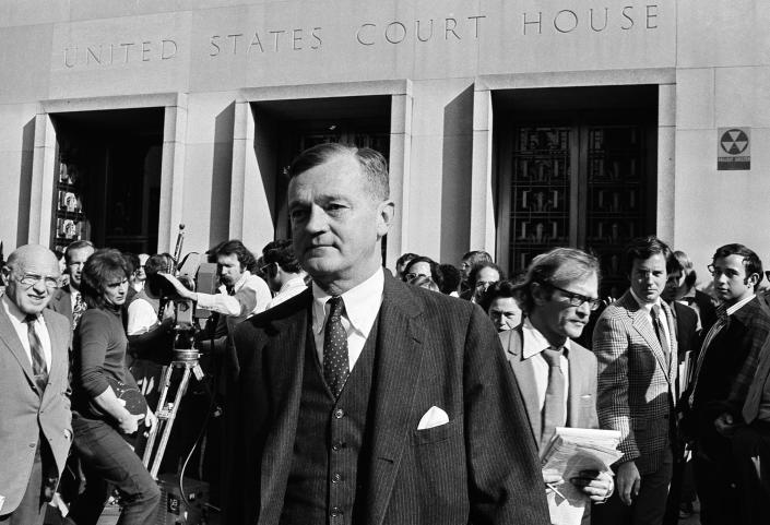<p>Nixon’s lawyer Charles Wright leaves the U.S. District Court in Washington after meeting with Judge John Sirica, Oct. 23, 1973. Wright told the judge that Nixon has agreed to let him hear the Watergate tapes. (Photo: Harvey Georges/AP) </p>