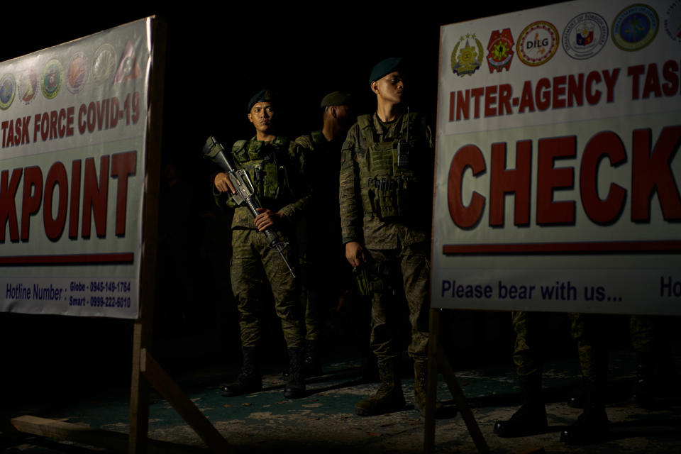 Philippine military personnel stand in a formation during a send off to different parts of Metropolitan Manila after president Duterte ordered a lockdown to contain the novel COVID-19 virus on March 14, 2020 in Manila<span class="copyright">Jes Aznar—Getty Images</span>