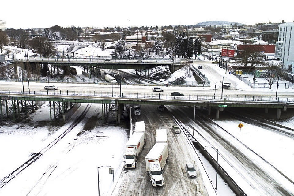 The area where Interstate 5 and I-84 meetup is covered in snow on Thursday, Feb. 23,2023 in Portland, Ore. (Dave Killen /The Oregonian via AP)