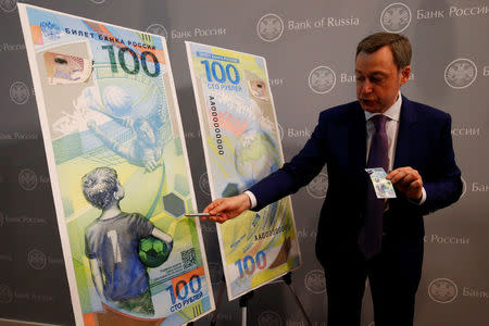 FILE PHOTO: General Director of Goznak state firm Arkady Trachuk attends a news conference unveiling the newly designed 100-rouble banknote dedicated to the 2018 FIFA World Cup, in Moscow, Russia May 22, 2018. REUTERS/Sergei Karpukhin/File Photo