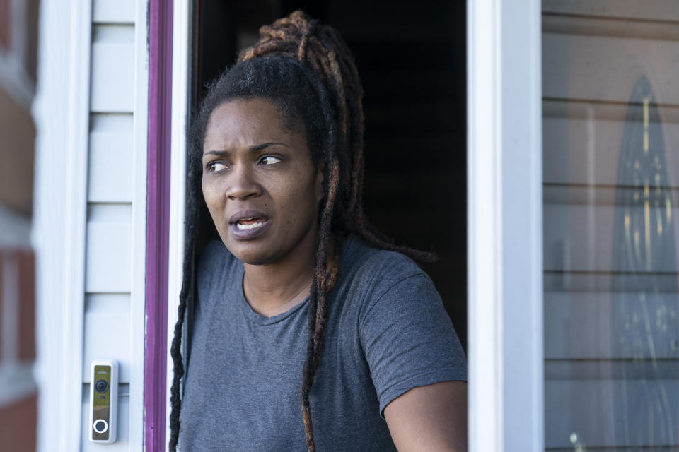 Alicia McDuffie speaks with The Associated Press after police served a search warrant at the home of her neighbor, the suspected shooter of a mass shooting at a Walmart, Wednesday, Nov. 23, 2022, in Chesapeake, Va. Police say a shooter opened fire in the store, leaving six people dead. It was the country’s second high-profile mass killing in a handful of days. (AP Photo/Alex Brandon)