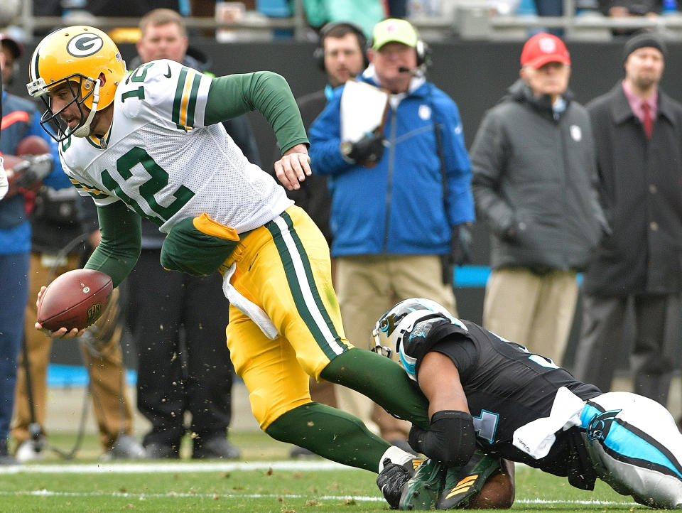 <p>Jairus Byrd #31 of the Carolina Panthers tackles Aaron Rodgers #12 of the Green Bay Packers during their game at Bank of America Stadium on December 17, 2017 in Charlotte, North Carolina. (Photo by Grant Halverson/Getty Images) </p>