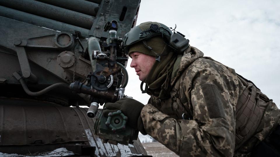 A Ukrainian serviceman adjusts a system through the scope near Bakhmut on Feb. 7, 2023. (Yasuyoshi Chiba/AFP via Getty Images)