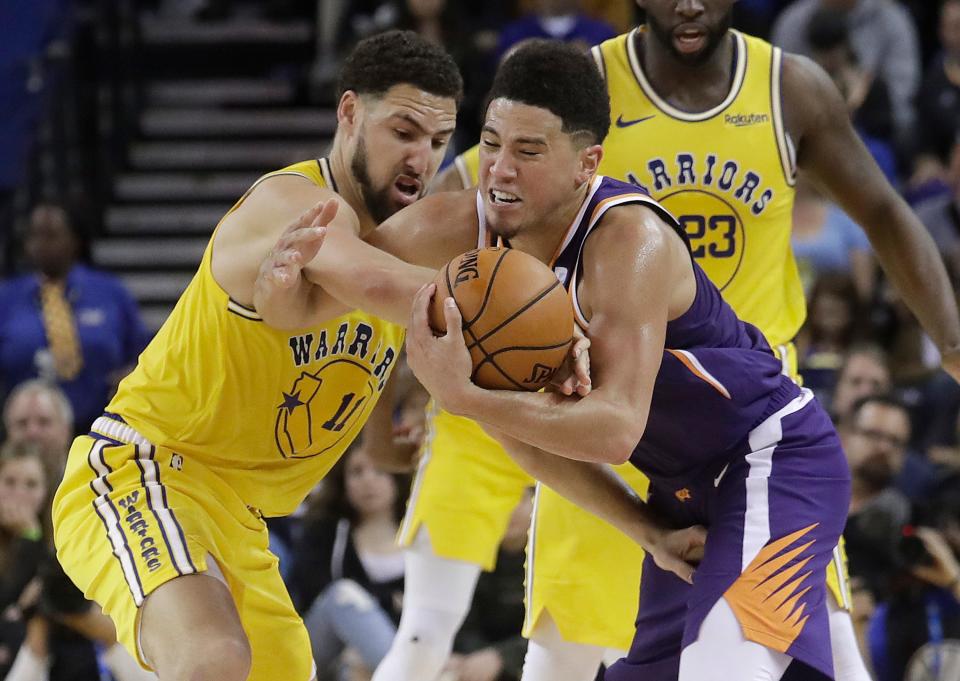The Golden State Warriors' Klay Thompson, who hasn't played this season, currently leads the Phoenix Suns' Devin Booker in NBA All-Star fan voting.