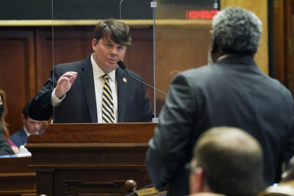 Rep. Joey Hood, R-Ackerman, left, answers a question from Rep. John Faulkner, D-Holly Springs, about legislation he presented in the House Chamber at the Mississippi Capitol in Jackson, Thursday, March 3, 2022. (AP Photo/Rogelio V. Solis)