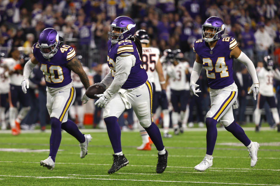 Minnesota Vikings defensive tackle Sheldon Day (52) celebrates after recovering a fumble during the second half of an NFL football game against the Chicago Bears, Monday, Nov. 27, 2023, in Minneapolis. (AP Photo/Bruce Kluckhohn)