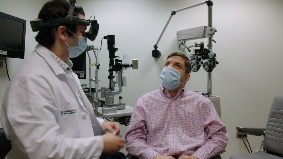 Trial participant Michael Kalberer at a follow-up appointment after receiving the experimental CRISPR-based therapy. - Mass Eye and Ear