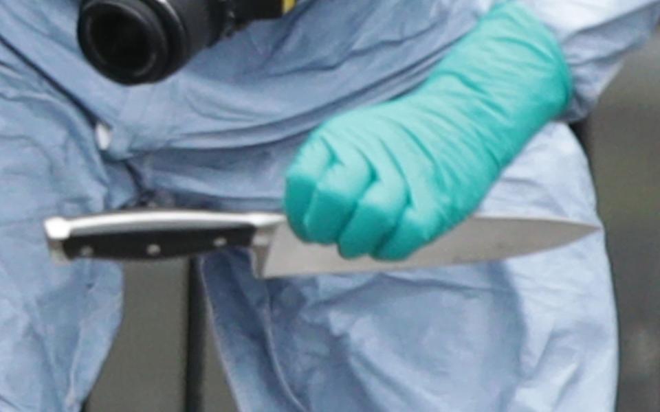  Forensic Officers looking at with knifes at the scene  - Credit: Yui Mok/PA Wire