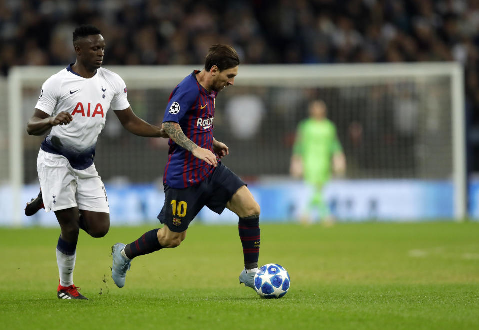 Barcelona forward Lionel Messi, right, duels for the ball with Tottenham midfielder Victor Wanyama during the Champions League Group B soccer match between Tottenham Hotspur and Barcelona at Wembley Stadium in London, Wednesday, Oct. 3, 2018. (AP Photo/Kirsty Wigglesworth)