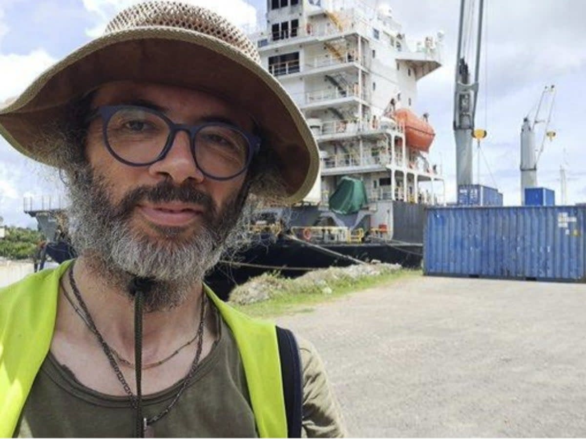 Dr Gianluca Grimalda pictured on his 9,300-mile overland journey to Papua New Guinea. The senior climate researcher at the Kiel Institute in Germany, faces losing his job over his refusal to fly (Gianluca Grimalda)