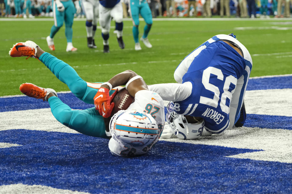 Dolphins defensive back Steven Parker (26) rolls away with the ball after stripping it in the end zone from Indianapolis Colts tight end Eric Ebron (85) during the first half of an NFL football game in Indianapolis, Sunday, Nov. 10, 2019. The play was rule an interception by Parker. (AP Photo/AJ Mast)