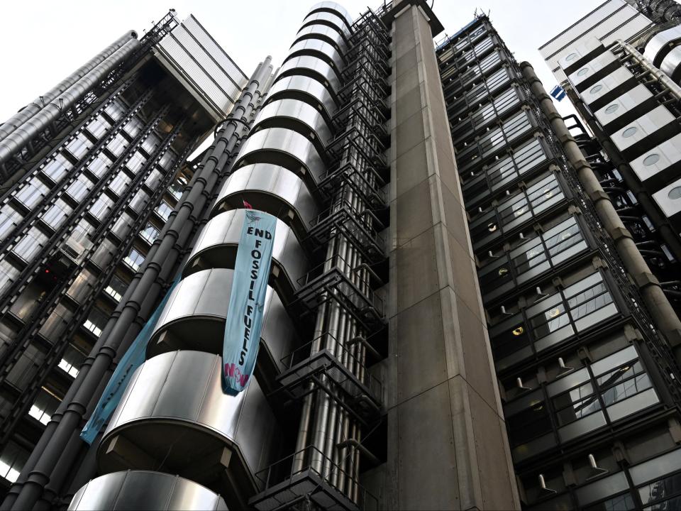 Activists from the Extinction Rebellion, demonstrate at the Lloyds of London’s head office (AFP via Getty Images)