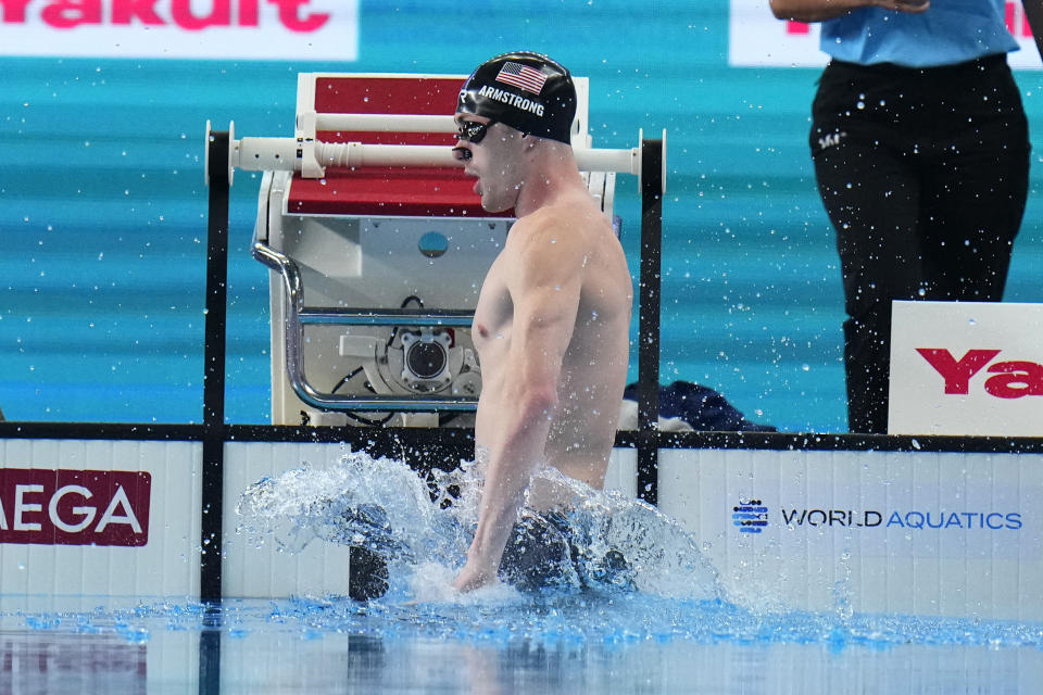 Hunter Armstrong of the United States warms up before the men's 100-meter backstroke final at the World Aquatics Championships in Doha, Qatar, Tuesday, Feb. 13, 2024. (AP Photo/Hassan Ammar)