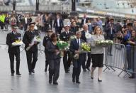 <p>Labour Shadow Home Secretary Diane Abbott, London Mayor Sadiq Khan and Home Secretary Amber Rudd lay floral tributes near London Bridge station, the day after a terror attack in June which killed eight people and left 48 injured. (Rex/Shutterstock) </p>