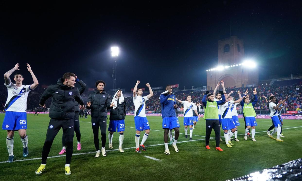 <span>The Inter players celebrate their win away to Bologna.</span><span>Photograph: Giuseppe Maffia/NurPhoto/Shutterstock</span>
