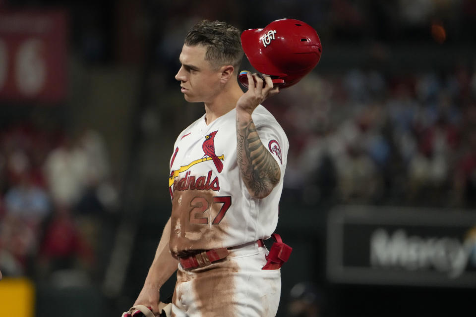 St. Louis Cardinals' Tyler O'Neill removes his helmet after flying out to end the fifth inning of a baseball game against the Atlanta Braves Monday, April 3, 2023, in St. Louis. (AP Photo/Jeff Roberson)