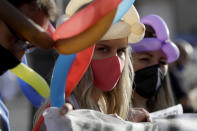 Disco and dance club operators stage a protest against government's order for them to close in order to curb the spread of coronavirus, in Rome Thursday, Oct. 22, 2020. Authorities in regions including Italy's three largest cities have imposed curfews in a bid to slow the spread of COVID-19 where it first struck hard in Europe, most of whose countries are now imposing, or mulling, new restrictions to cope with rapidly rising caseloads. (AP Photo/Gregorio Borgia)