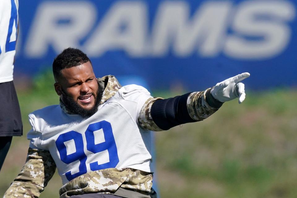 Rams defensive end Aaron Donald gestures prior to practice on Wednesday at Cal Lutheran University in Thousand Oaks.