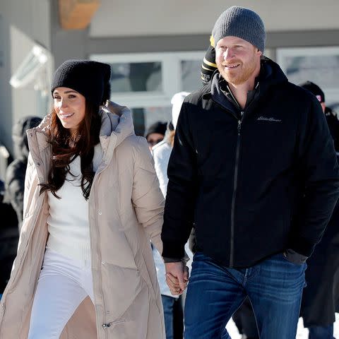 <p>Andrew Chin/Getty</p> Meghan Markle and Prince Harry attend Invictus Games Winter Training Camp in Canada on Feb. 14, 2024