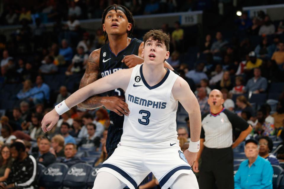 Oct 3, 2022; Memphis, Tennessee, USA; Memphis Grizzlies forward Jake LaRavia (3) boxes out Orlando Magic forward Paolo Banchero (5) during the first half at FedExForum.