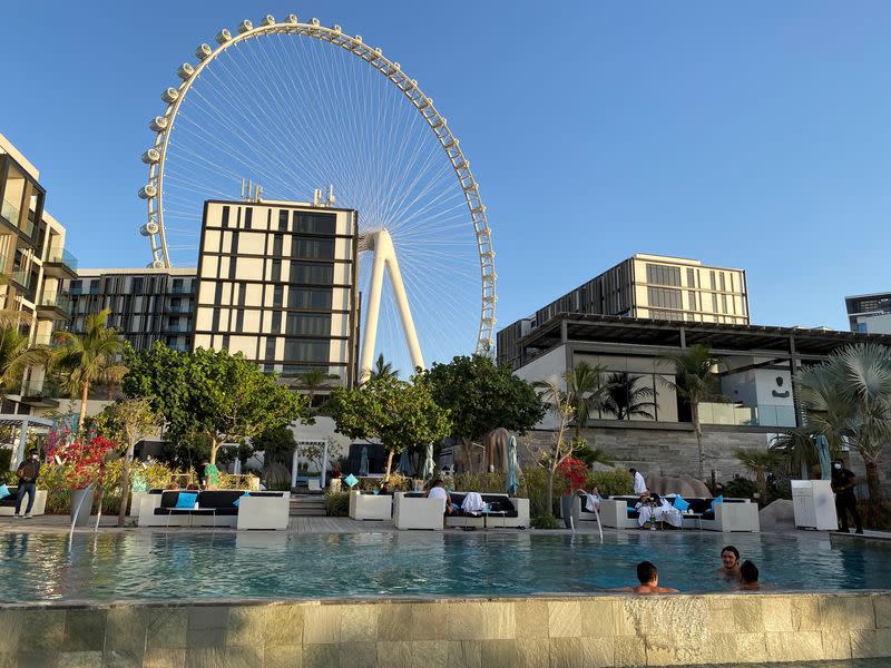 FILE PHOTO: People are seen at the Cove beach Caesars Palace, amid the spread of the coronavirus disease (COVID-19) in Dubai