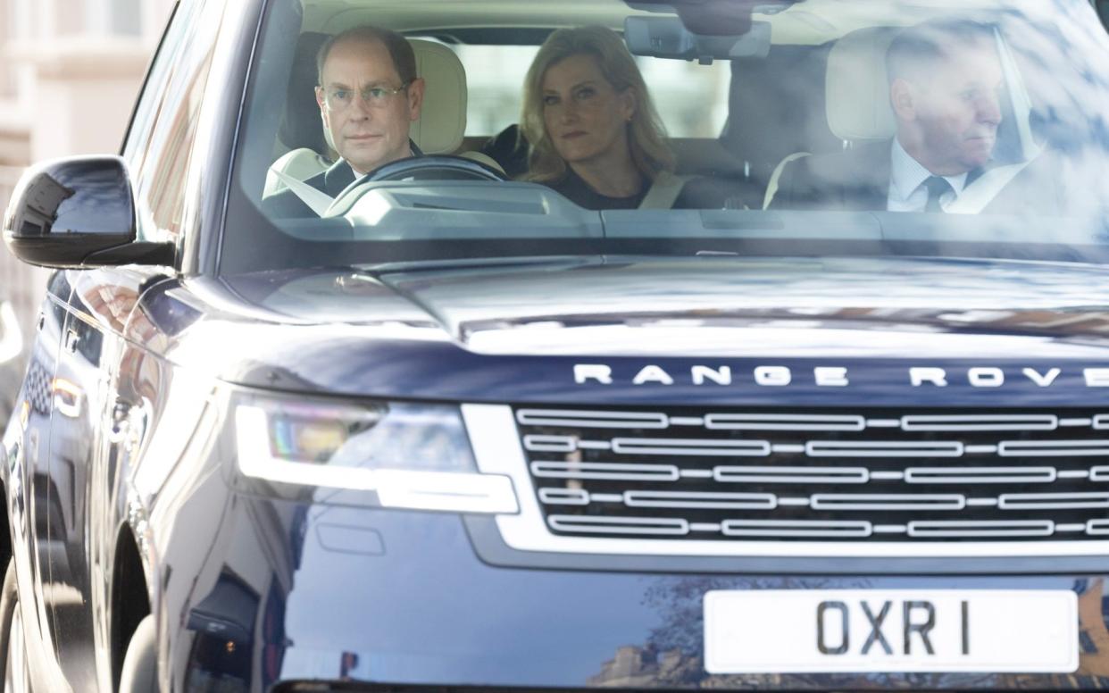 The Duke of Edinburgh drives into Windsor Castle in a car with his late father's personal number plate