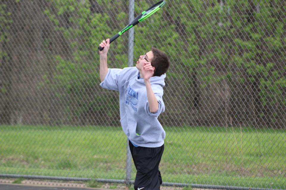 Blake Fitzgerald lines up a serve at the Metro Athletic Conference Championships on Wednesday, May 4, 2022.